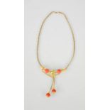 A gilt metal, enamel and coral necklace, the central bead enamelled with green and white foliage,