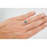 A 14ct white gold and blue topaz and diamond ring, size M, 1.6g.