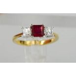 An 18ct yellow gold 1ct ruby and diamond trilogy ring, the 1ct ruby flanked by diamonds totalling