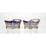 A pair of silver and blue glass lined basket form salts, continental, 2.88toz.