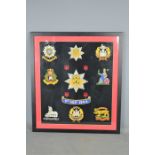 A framed embroiled picture commemorating the formation of The Royal Anglia regiment 1st September
