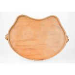 A Robert Thompson 'Mouseman' oak kidney shaped tray with carved trademark mice carved to the edge,