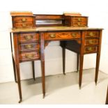 A 19th century rosewood ladies writing desk, with concave drawers, inlaid with satinwood decoration,