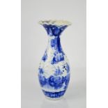A 19th century blue and white vase, with raised modelled figures to the body, 24cm high.