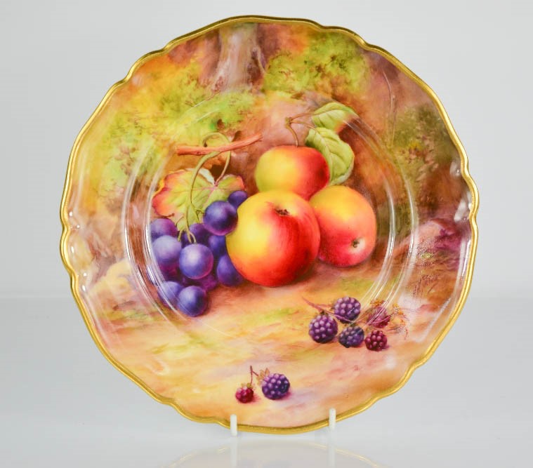 A Royal Worcester plate, hand painted with apples, grapes and blackberries, signed Horice Price,