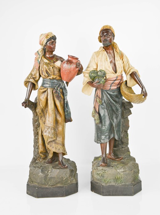 A pair of 19th century terracotta painted figures by Johann Maesch, with stamped initials J.M. and