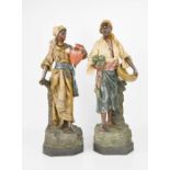 A pair of 19th century terracotta painted figures by Johann Maesch, with stamped initials J.M. and