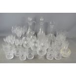 A large quantity of crystal glasses, decanters and claret jug