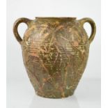 A 19th century stoneware glazed twin handled jar, decorated with raised slip, possibly North Devon