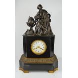 A Victorian mantle clock, cast with a bronze figure and globe to the top, and the dial bearing