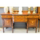 A Victorian marquetry mahogany sideboard, inlaid with satinwood medallions, ribbons and bows, with
