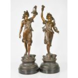 A pair of 19th century French spelter figurines, one holding a basket of flowers, the other
