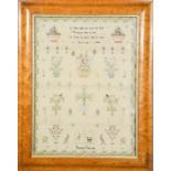 A Victorian sampler by Elizabeth Gray, dated 1814, depicting flowers and figures and having a