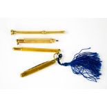 Two gold plated propelling pencils one with Amethyst set top and one further example with a fruit