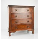 A 19th century mahogany apprentice chest, with four drawers, on bracket feet, with drop handles.