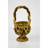 A 19th century stoneware modelled basket with twist handle, 24cm high.