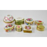 A group of trinket boxes, including Limoges examples.