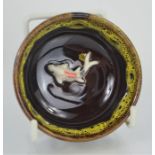 A Chinese handcarved, painted and glazed teabowl with embossed gold fish - 4cms x 7cm