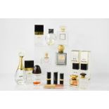 A group of vintage Chanel boxes and bottles, including Coco Chanel, Chanel No.5, and other perfumes,
