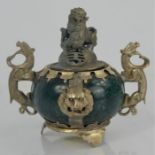 A Vintage Chinese natural green jade incense burner with Miao silver mounts, dragon handles, lions