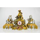 A spelter 19th century clock garniture, with mantle clock to the centre flanked by figures with