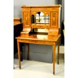 A fine 19th century rosewood and satinwood bonheur de jour, inlaid with chippendale style urns and