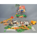 A group of vintage Britains diecast vehicles and plastic animals and figures