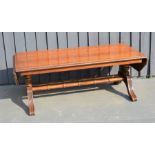 A mahogany veneered coffe table with drop ends