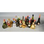 A quantity of vintage miniature alcohol bottles.
