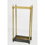 A 19th century brass stick stand, with cast iron tray.