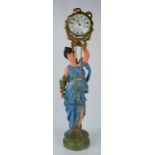 A French pendulum clock raised by a painted maiden wearing blue robes. 72cm