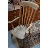 A Victorian oak slat back kitchen chair