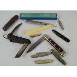 A jack knife together with a group of vintage pen knives and a Solingen 655 cutthroat razor