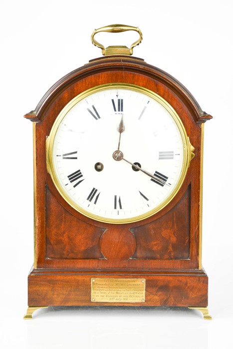 An Edwardian mahogany bracket clock, circa 1918 with a brass carrying handle and brass plaque to the