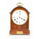 An Edwardian mahogany bracket clock, circa 1918 with a brass carrying handle and brass plaque to the
