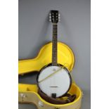 A Blueridge six string banjo in a fitted case.