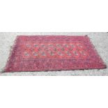 An antique Persian rug, and an antique runner with red ground.