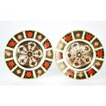 A pair of Royal Crown Derby plates, in the Imari pattern no 1128, 22cm diameter.