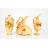 Three examples of miniature Royal Worcester; two ewers and a vase, each painted with flowers,