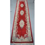 A red ground carpet runner 310cm