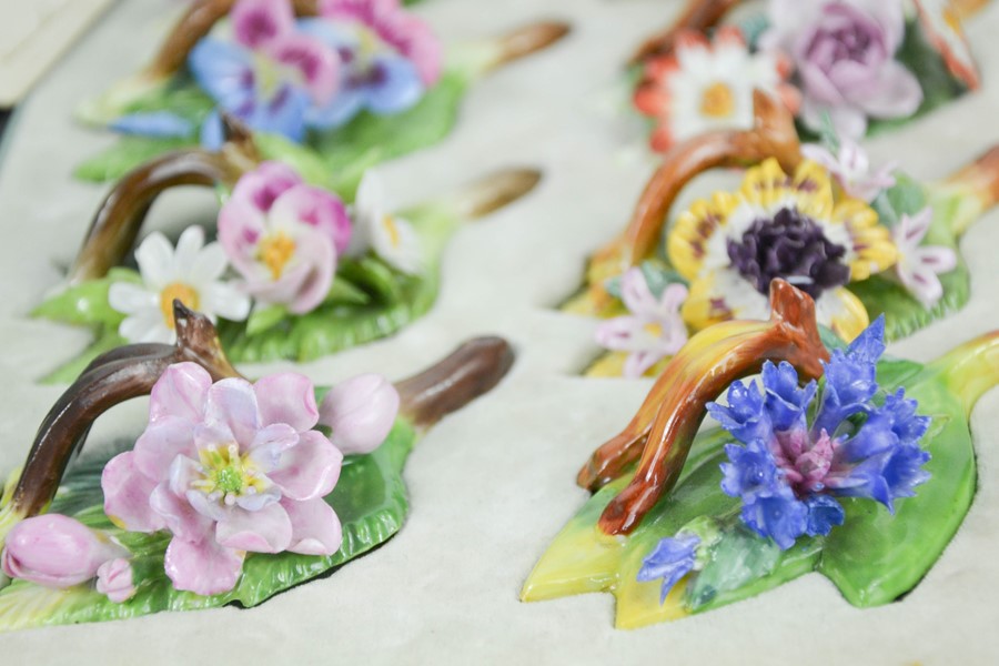 A fine set of Dresden floral table menu holders, modelled as different flowers, in the original - Image 6 of 7