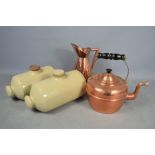 Two Victorian stoneware foot warmers, a copper kettle and a copper jug.