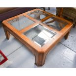 A modern coffee table with four glass panels.