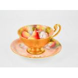 A Royal Worcester tea cup and saucer, painted with fruit, pears and grapes, both signed Townsend.