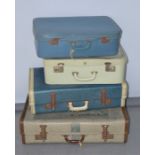 Four vintage suitcases
