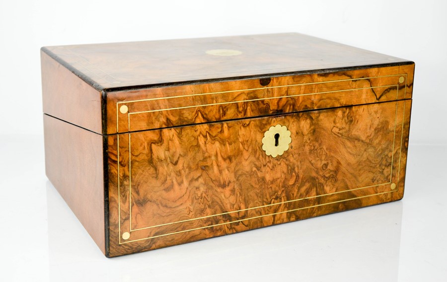 A 19th century burr walnut writing box with slope and fitted interior, key and glass inkwells, 16 by