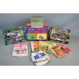 A quantity of vintage toys to include a battery operated vibrating antique car, Thunderbirds toy car