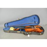 A Violin and bow, in hard case.