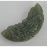 A Chinese natural Heitian green jade handcarved fan shaped pendant