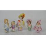 A group of vintage porcelain doll tops